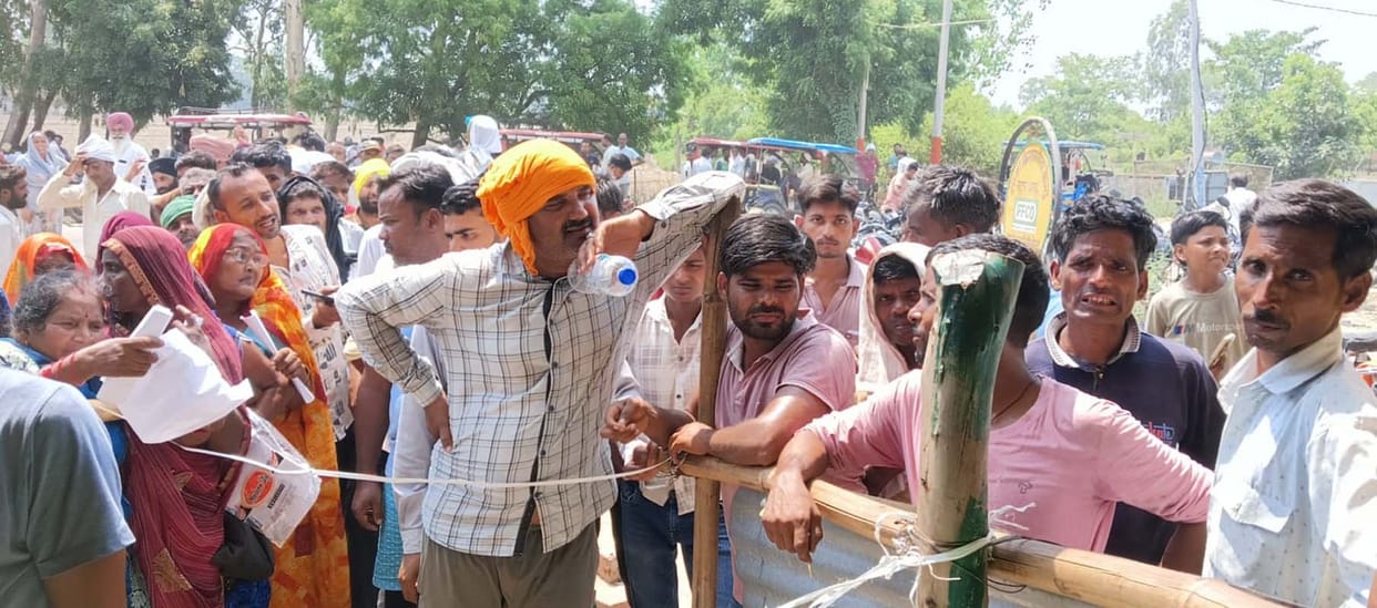 Long queues of farmers forming for urea at IFFCO centers.