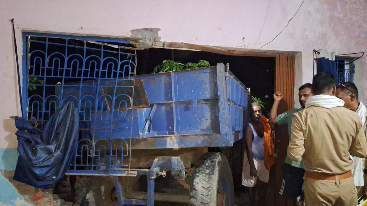 Tractor rams into house after hitting ambulance going to bring patient, driver dead, one injured