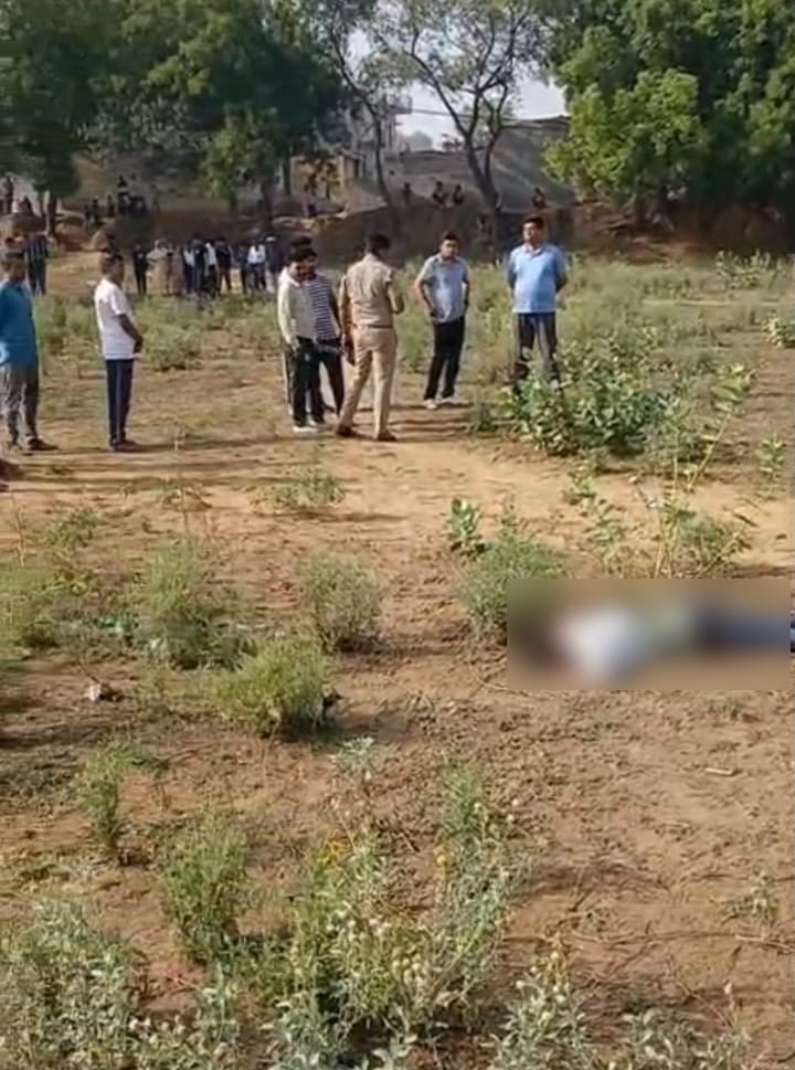 Blood-soaked body of a young man found in an open ground in Ghazipur.