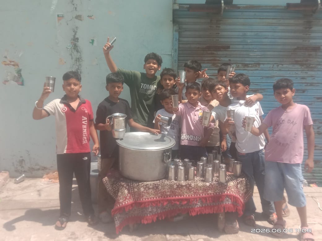 Small children gave cold water to passersby.
