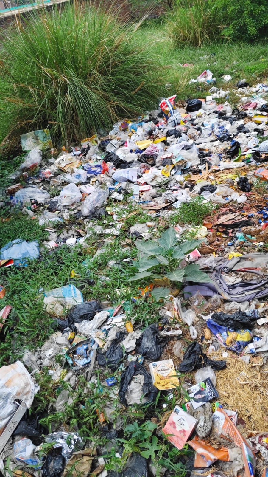 The road is in bad condition and there is no cleanliness and dirt spread all around.