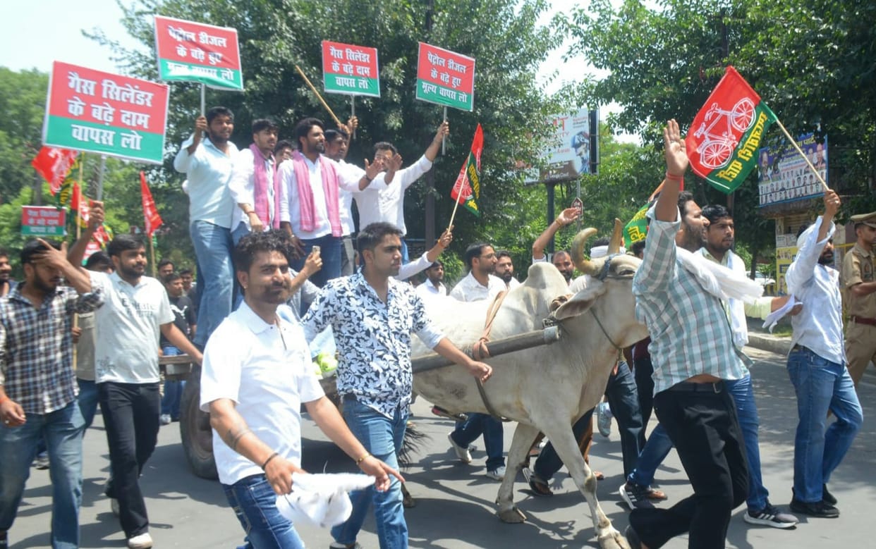 SP workers protested against the price hike of petrol and diesel by driving bullock carts.
