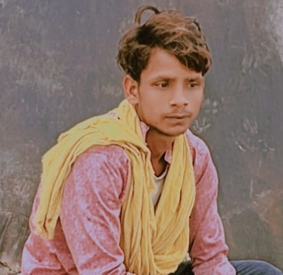 A young man drowned while bathing in the Ganga; villagers pulled out his body.
