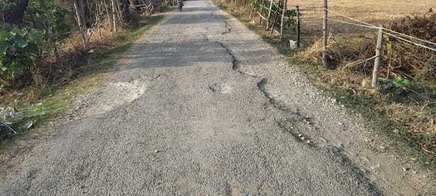 Many roads, including the connecting road, have turned into potholes