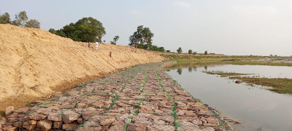 A stumbling block is being built to protect against erosion, yet the danger persists.