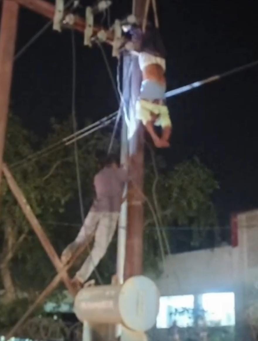 Lineman hung upside down from the pole for twenty minutes.
