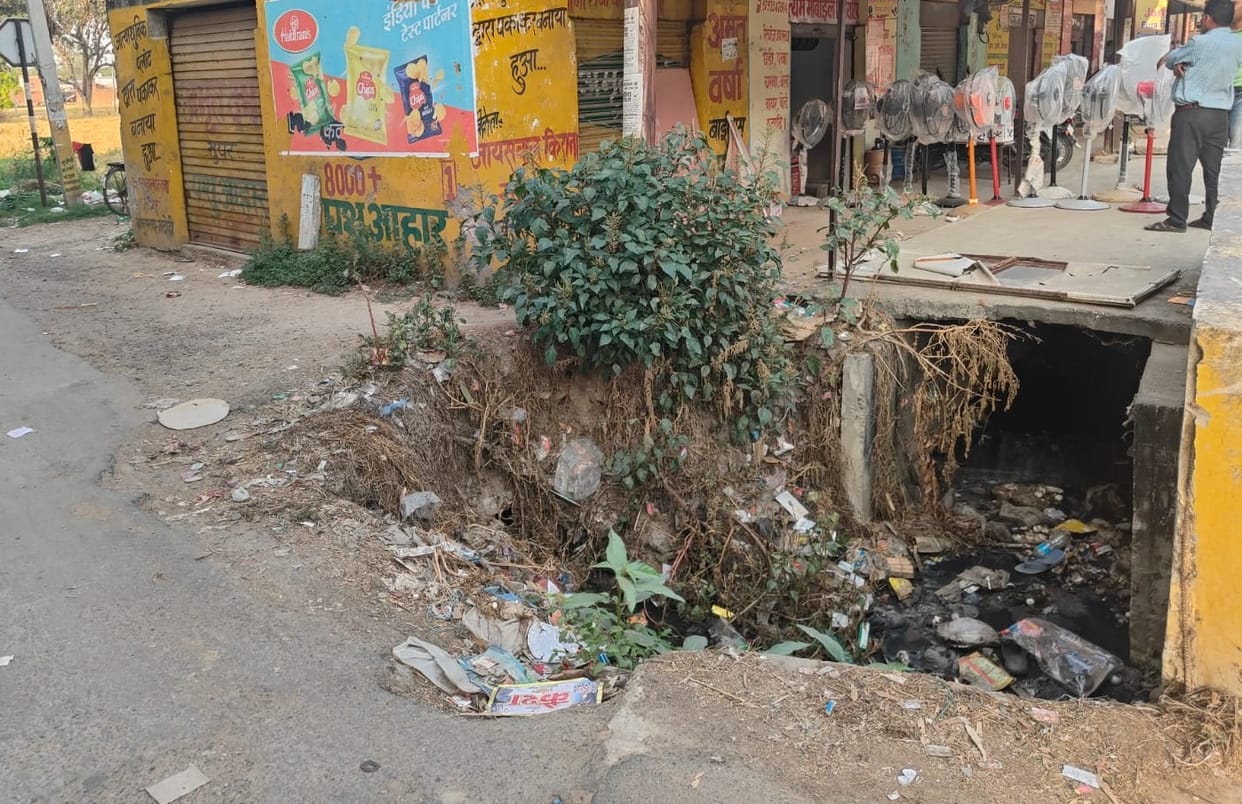 Open drain on the side of the road, inviting accidents