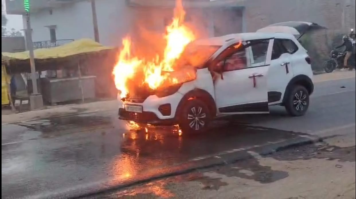 Car catches fire while moving; four occupants have a narrow escape.