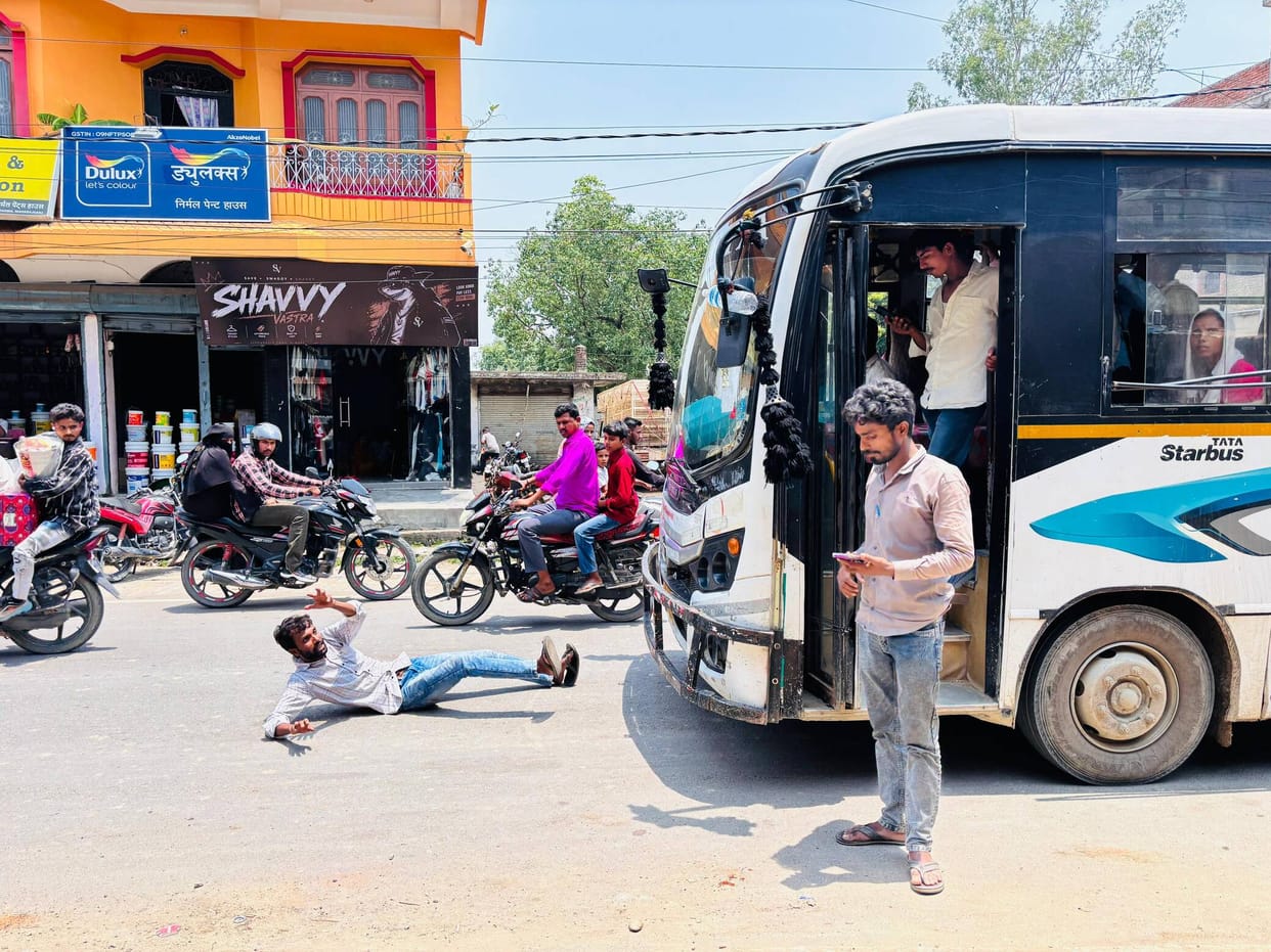 A drunk man obstructed traffic by lying down on a main road.