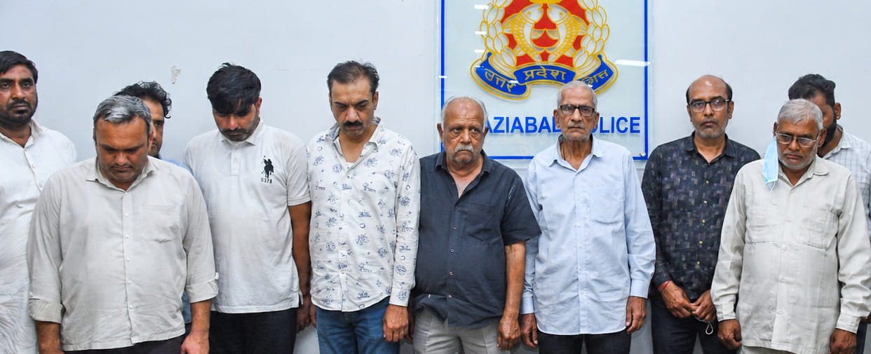 Ten people, including a retired accountant, were arrested for fraudulently selling land worth Rs 100 crore.