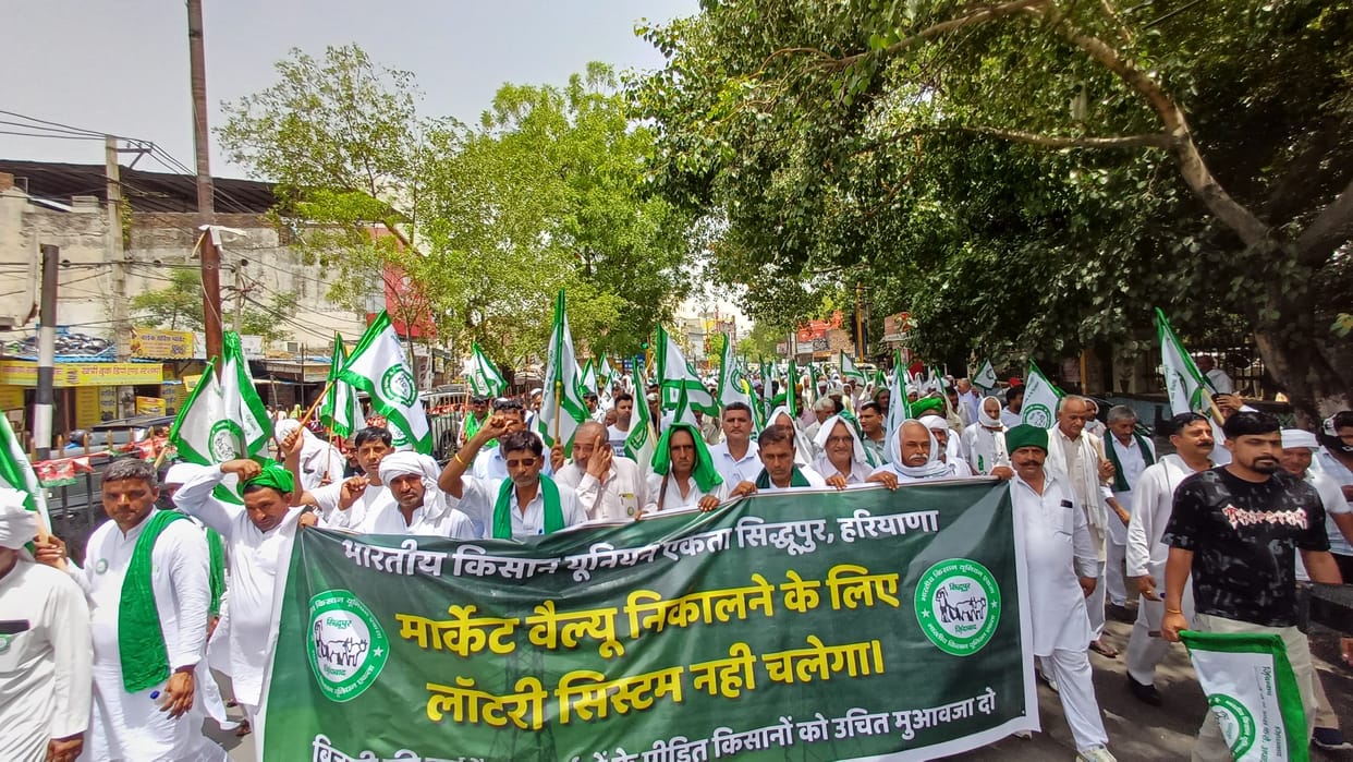 Farmers took out a foot march regarding payment for high tension wires.