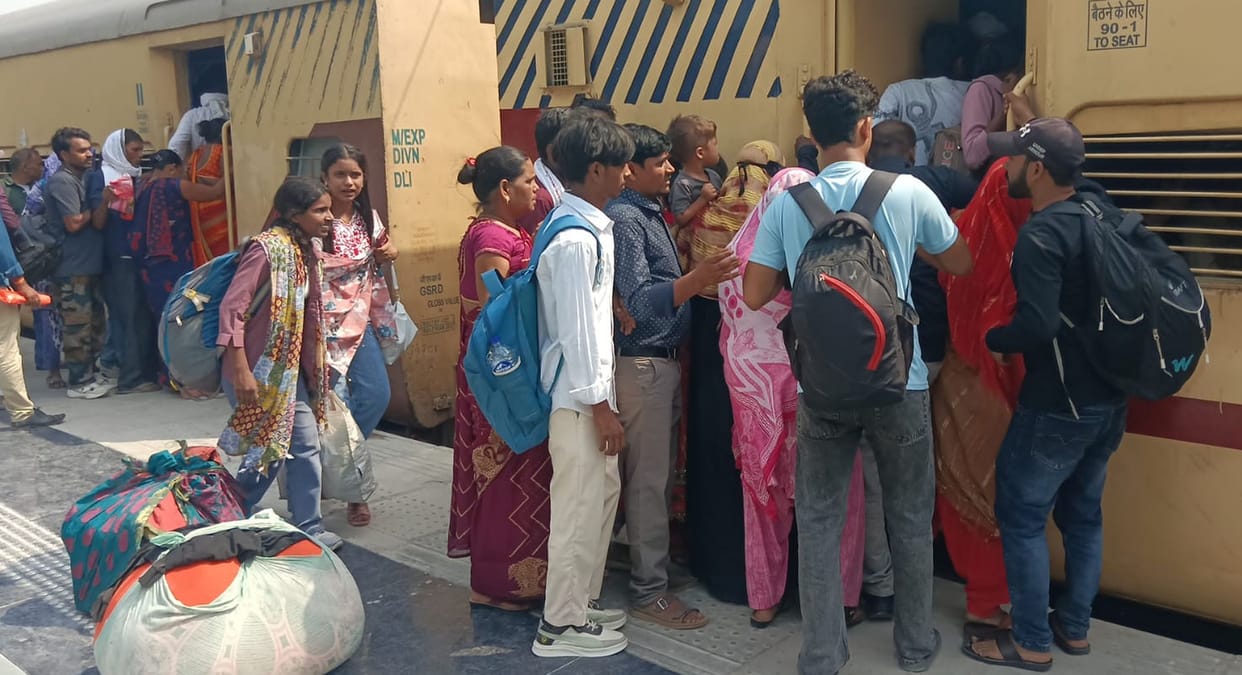 The crowd of candidates thronged buses and trains