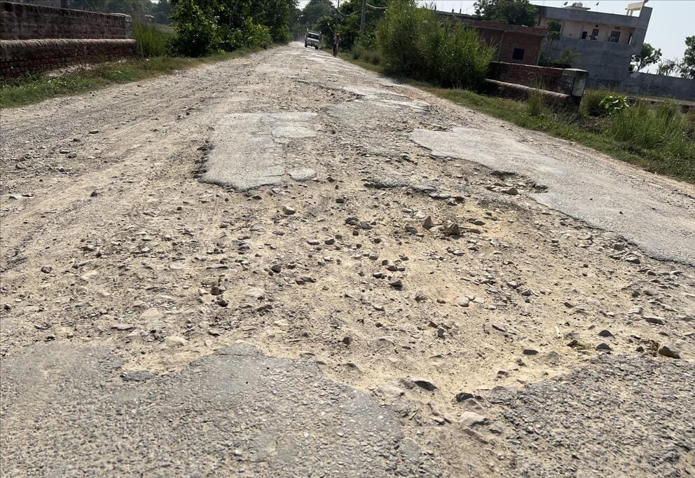 Crossing closed; the alternative road is riddled with thousands of potholes, causing jarring jolts