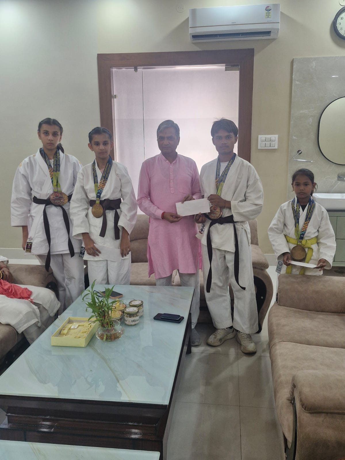 Karate players who won gold medals at the national level were honored at the Chief Minister's residence.