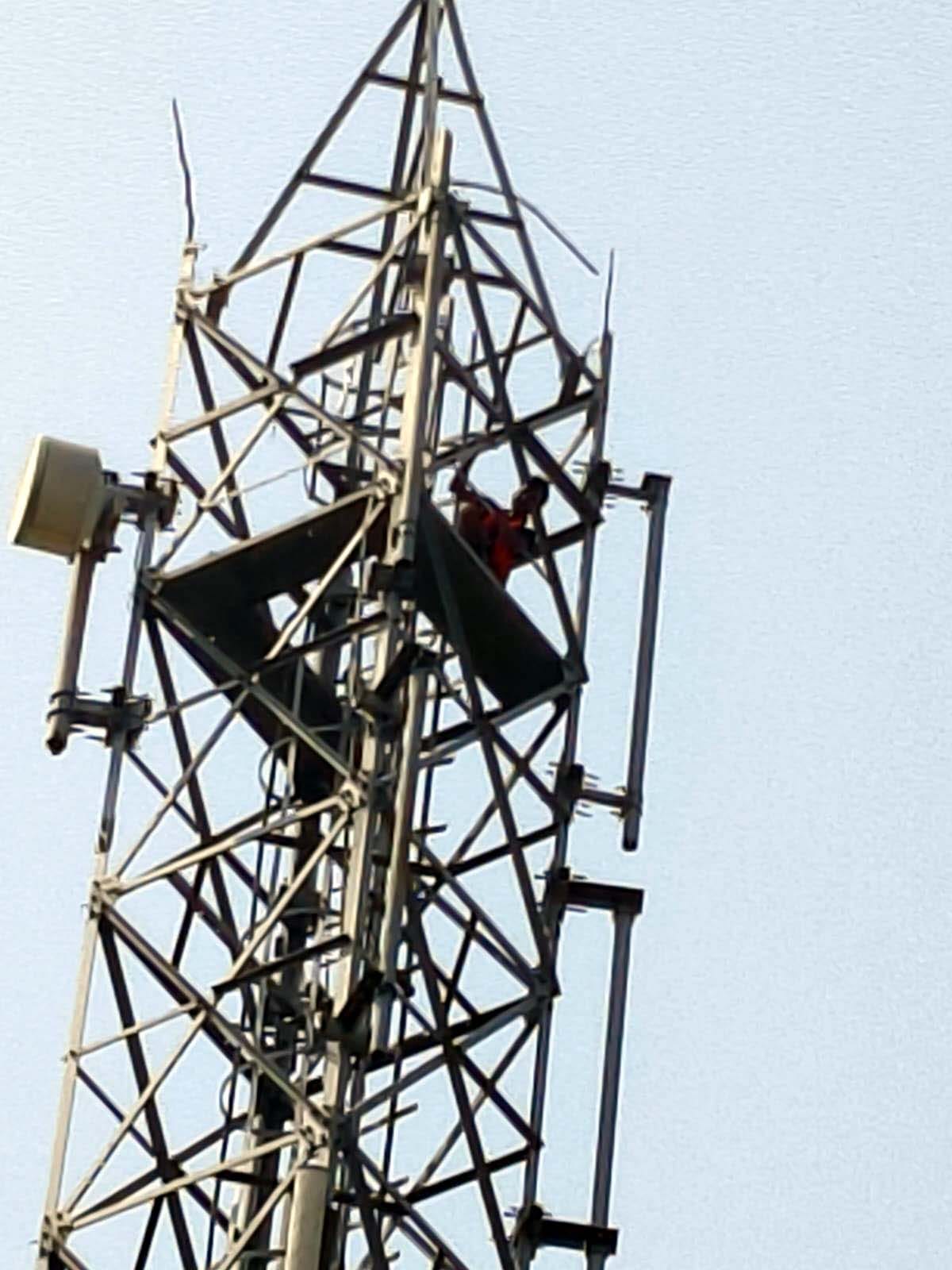 Youth climbs mobile tower after dispute with brother