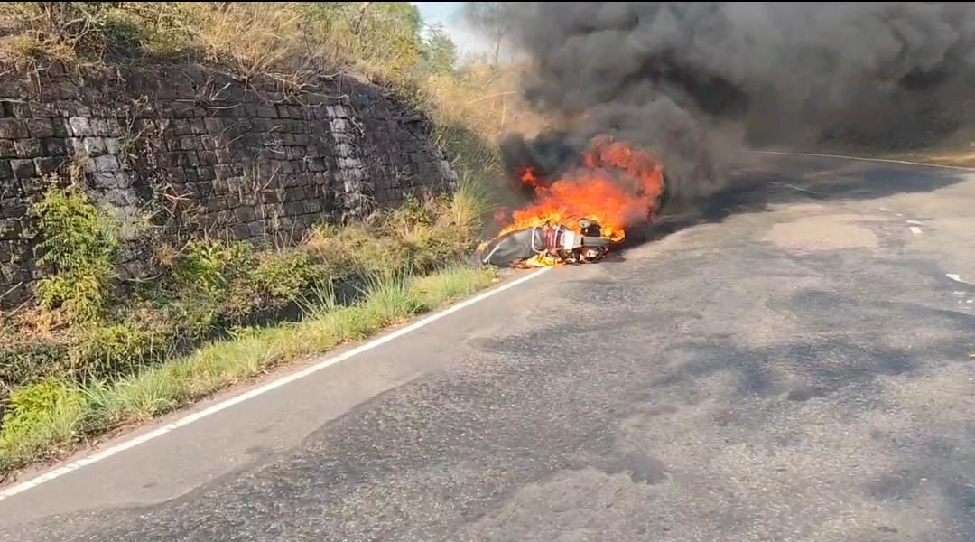 Moving scooter turns into a fireball; rider jumps off to save his life.
