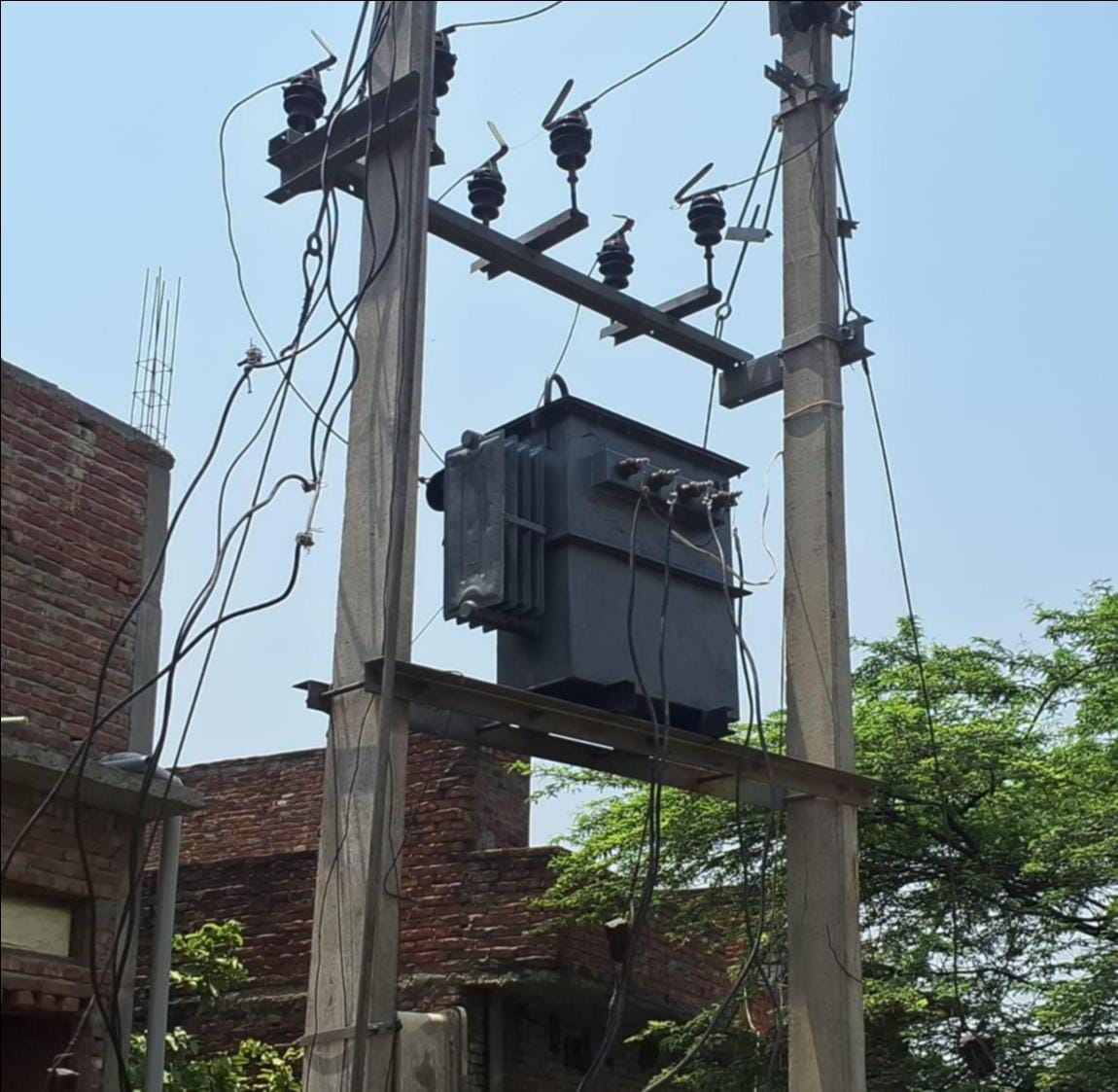 A 25 kVA transformer is supplying electricity to 150 households; overloading has caused villagers' refrigerators and motors to burn out