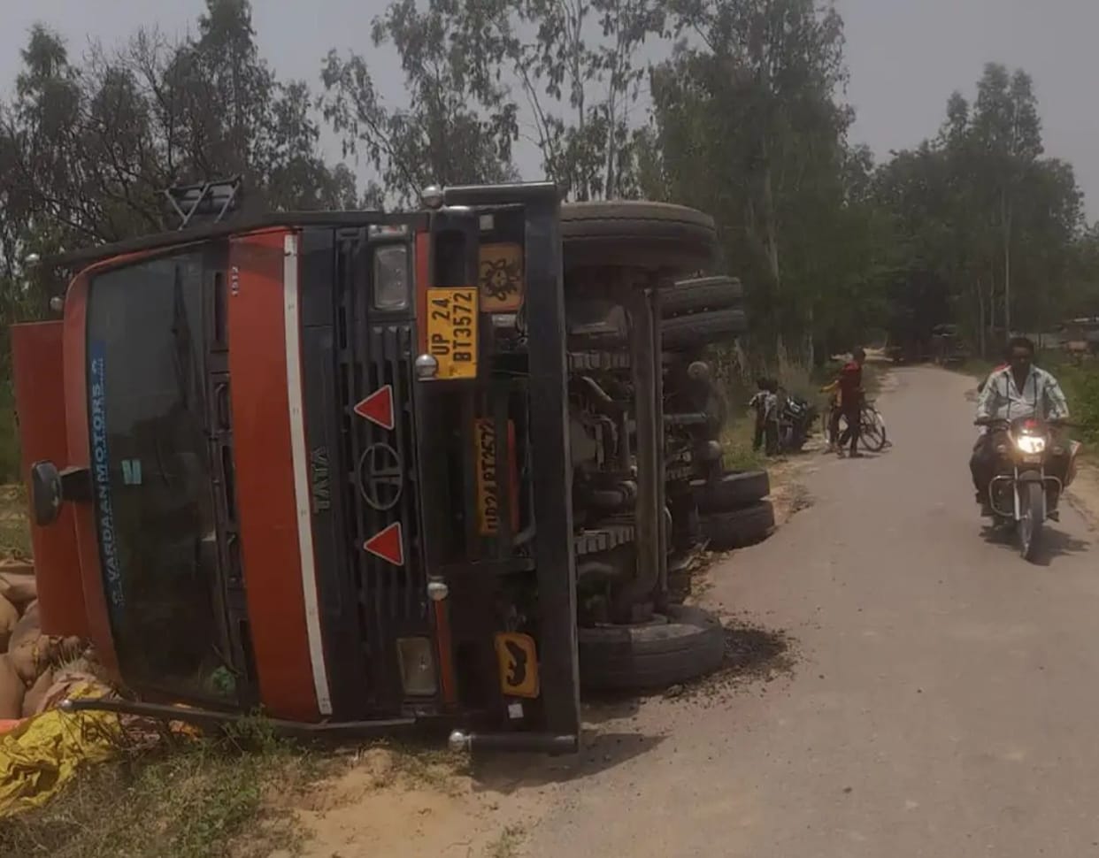 Motorcyclist dies after being struck by a tractor while trapped amidst a herd of cattle.