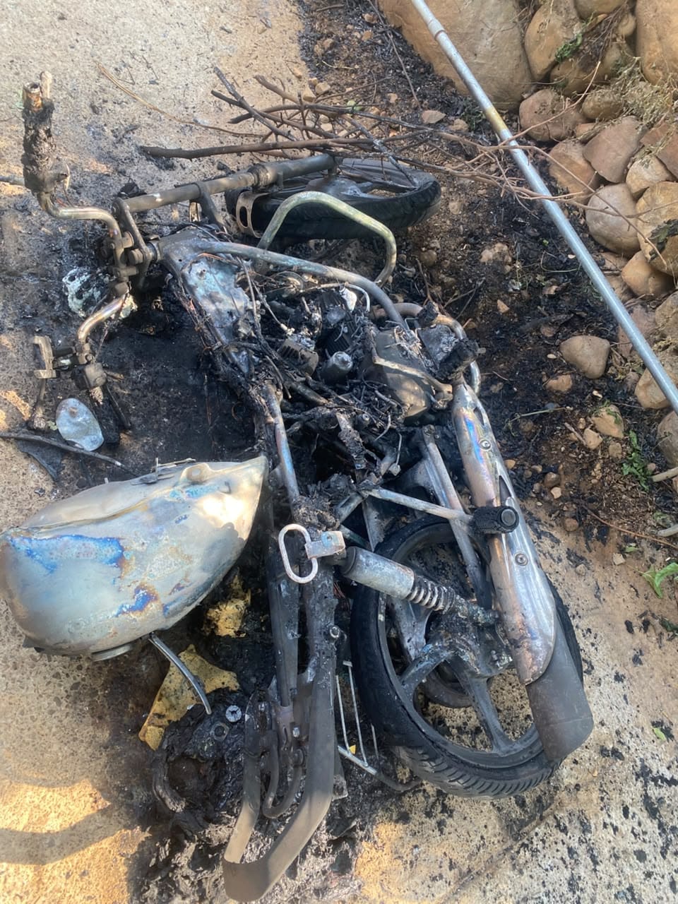 Bike engulfed in flames following an explosion; mischief-makers suspected.