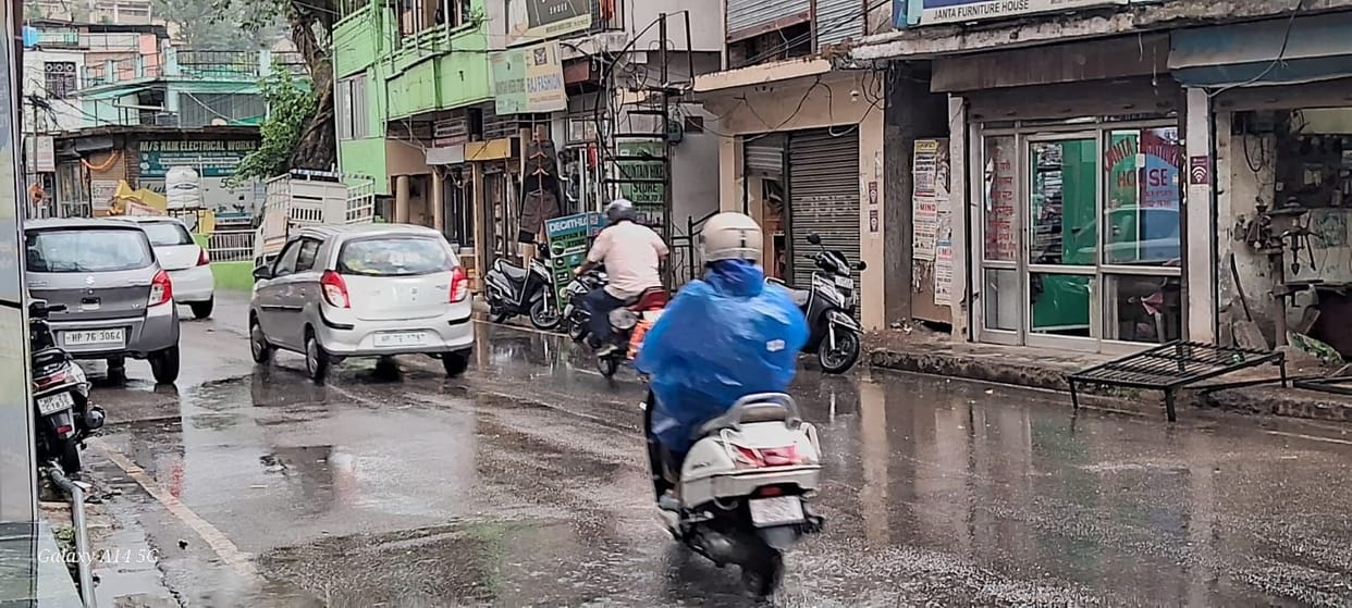 Intense morning sunshine caused heavy sweating; relief came with rain in the afternoon.