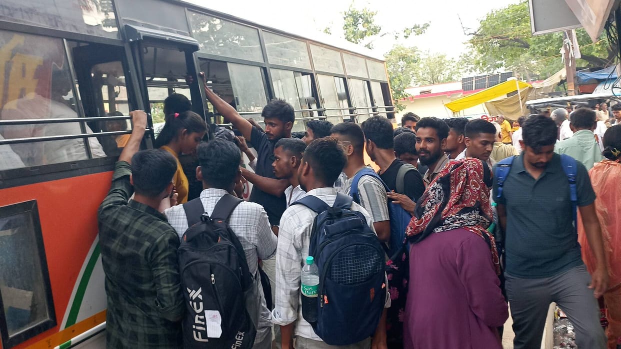 Angry candidates create ruckus due to non-operation of bus, surround TSI's vehicle