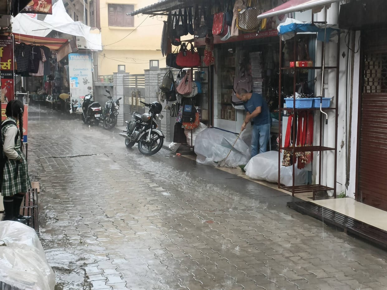 First rain exposes poor drainage system in Kunihar; water enters shops and homes.