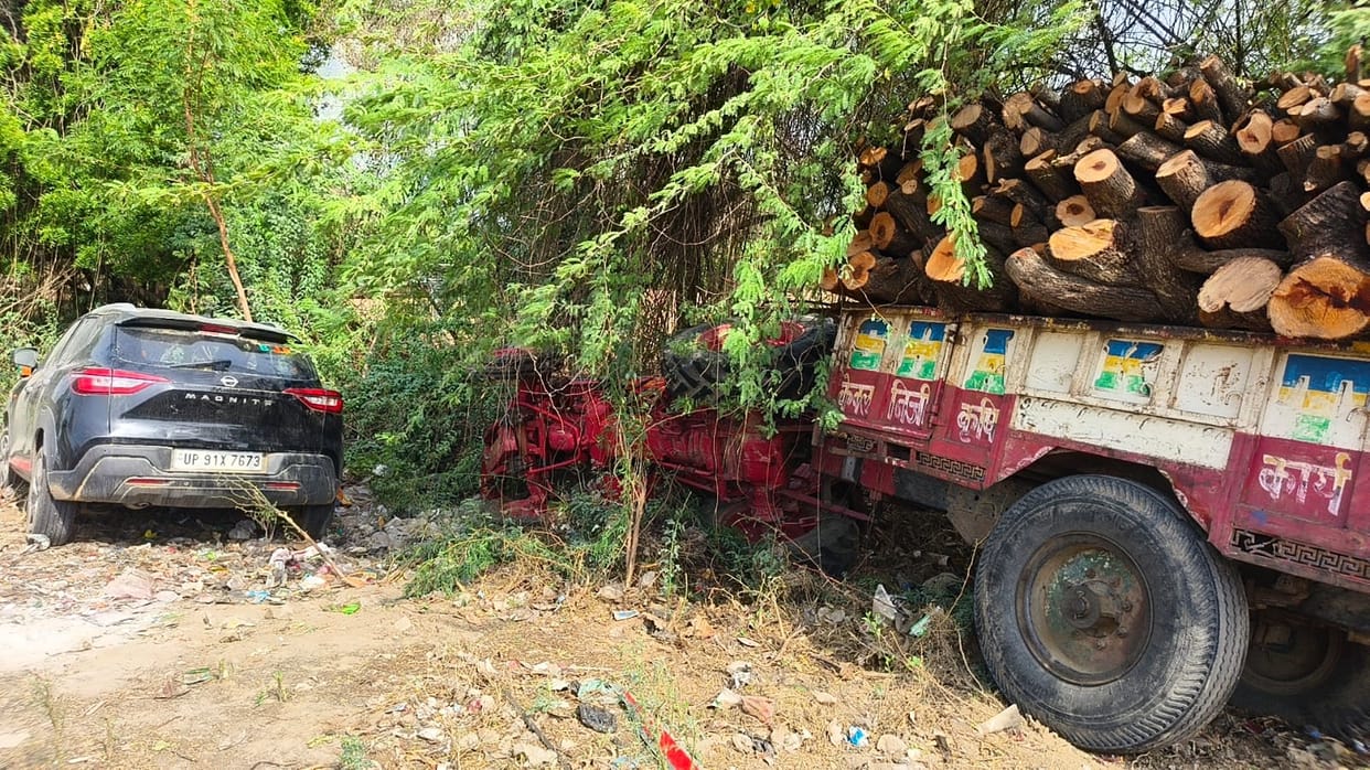 Two occupants of a car injured after being hit by a tractor loaded with illegal wood.