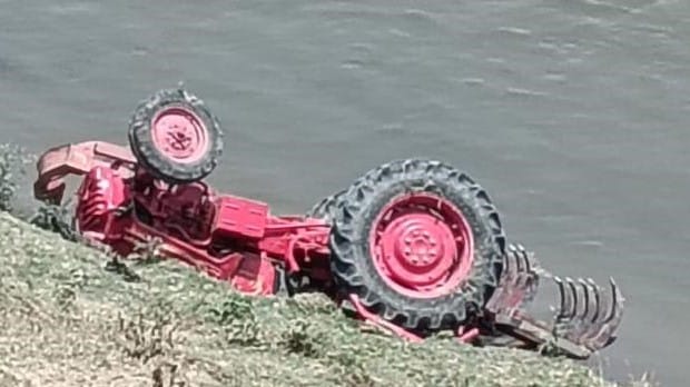 A tractor fell into the river while ploughing along the banks of the Yamuna.