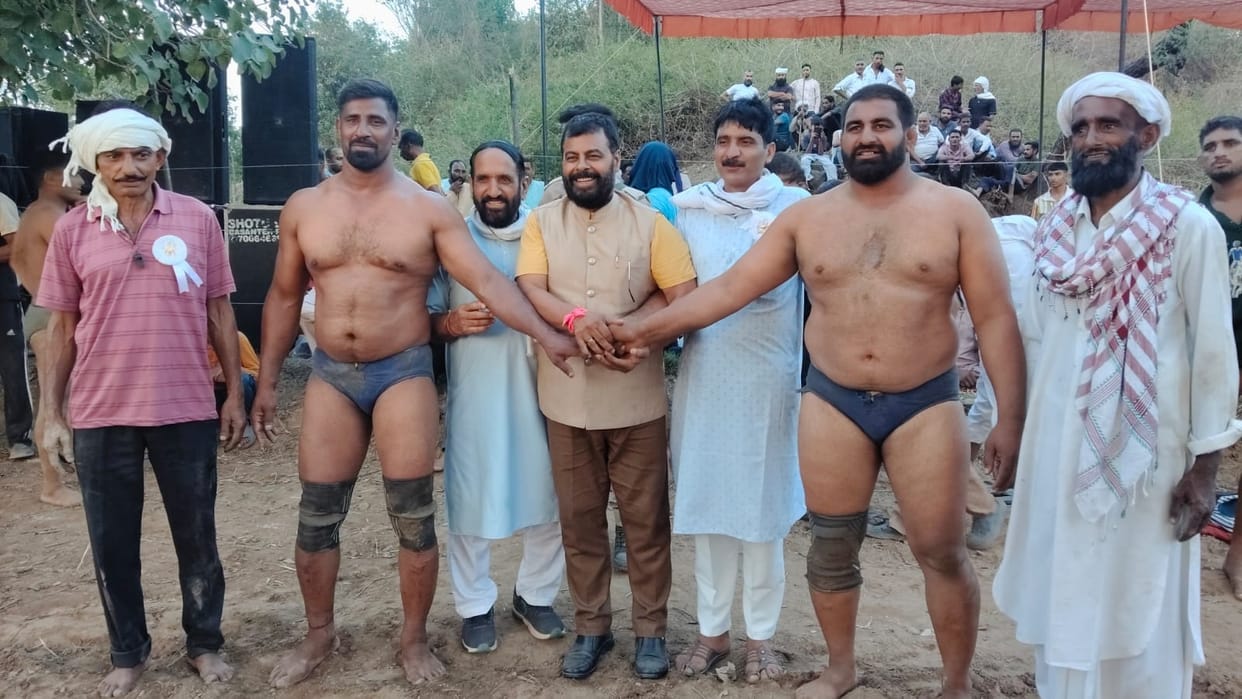 Wrestlers tested their moves to the beat of the dholak.