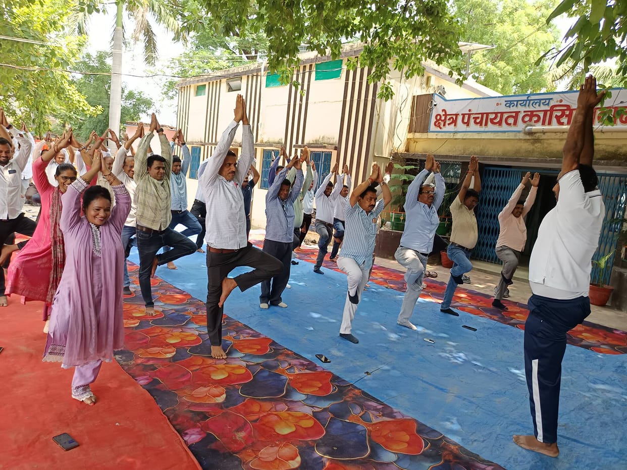 Officials and employees practiced yoga at the camp.