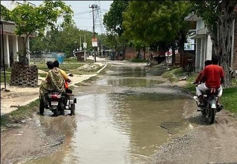 Drain built higher than the road; water accumulated on the road.