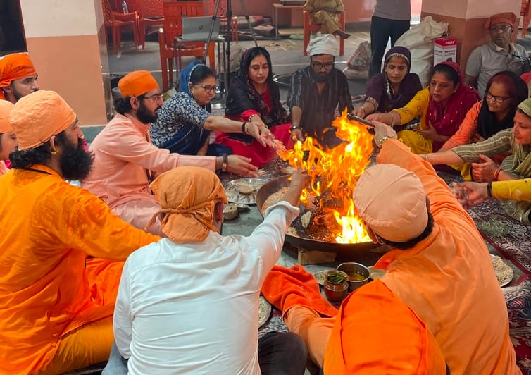 Praying for the welfare of the world through the Purnahuti Yajna and Havan.