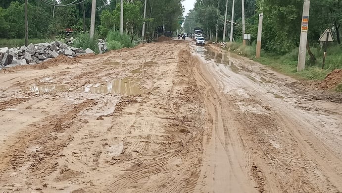 Rain turns under-construction state highway into a mud pit; vehicles stranded overnight