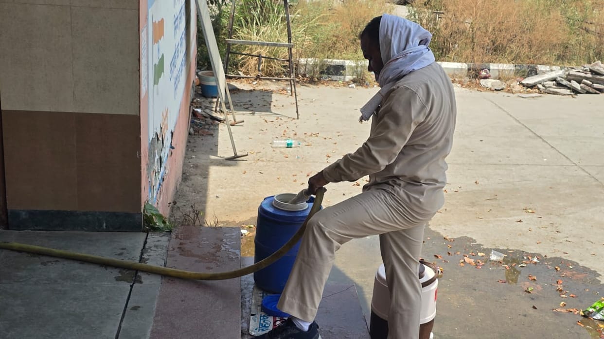 Water containers are being placed in buses for passengers amidst the scorching heat.