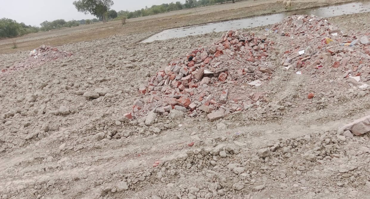 Farmer accuses property dealer of dumping debris on land
