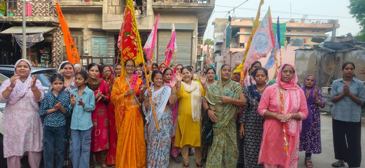 Devotees immersed in Radha-Krishna devotion.