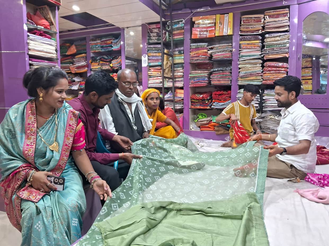 Markets buzz with the onset of the wedding season; crowds of shoppers swell at clothing stores.