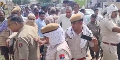 There was a loud uproar in Lalpur village over a border dispute, and a woman fainted
