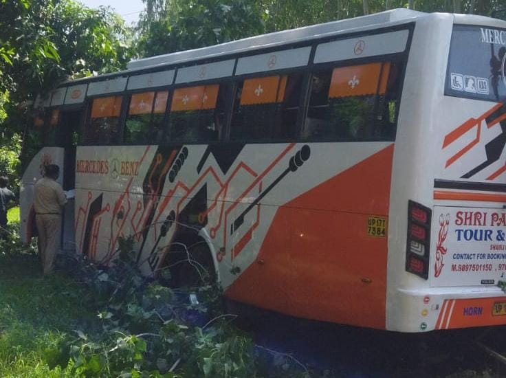 Pilgrims' bus lands in field, bike rider dies after being hit by it