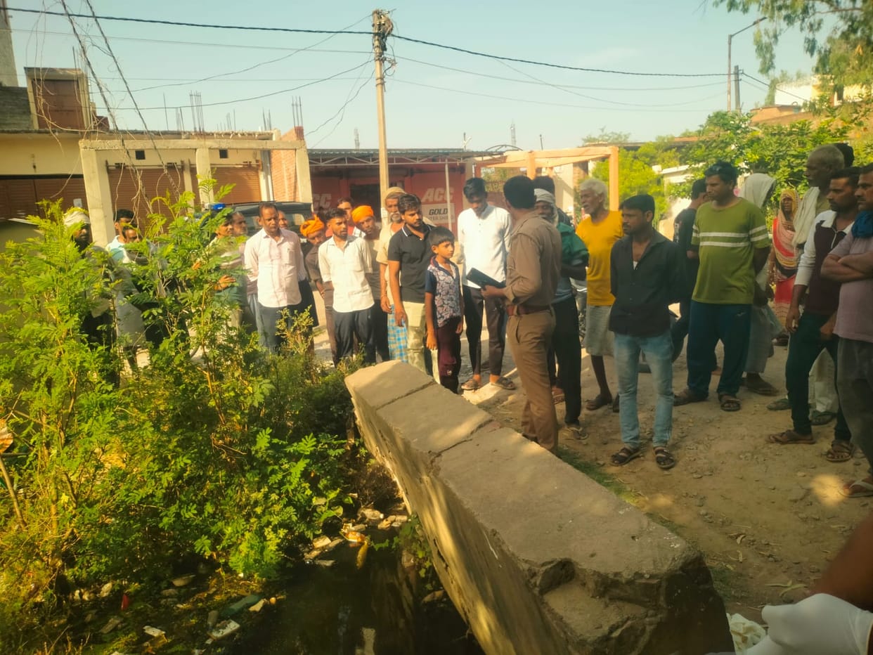 Body of a young man found floating in a drain under suspicious circumstances.
