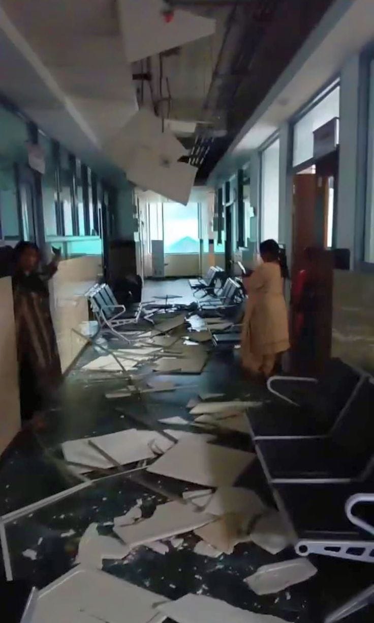 Heavy downpour turns roads into swimming pools; ceiling collapses in hospital building.