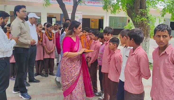 Students welcomed with a *tilak* of sandalwood paste and *roli*; attendance remained low on the first day.