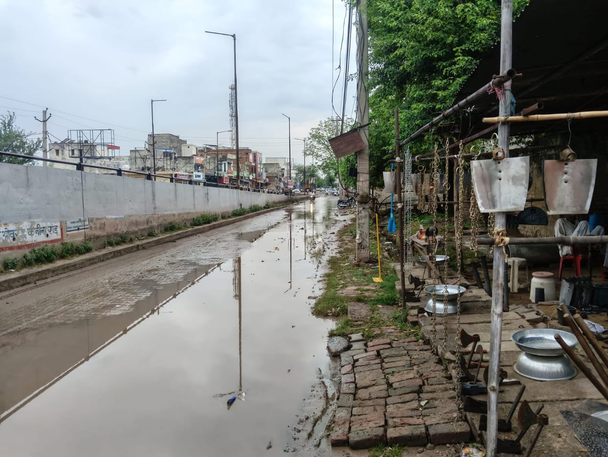 Overbridge built, but service road becomes a problem.