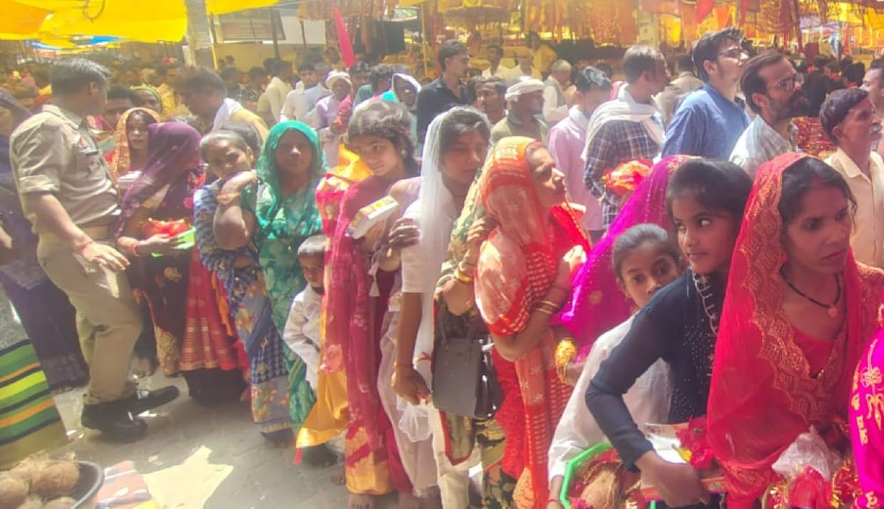 Devotees bowed their heads in reverence at the Goddess's shrine.
