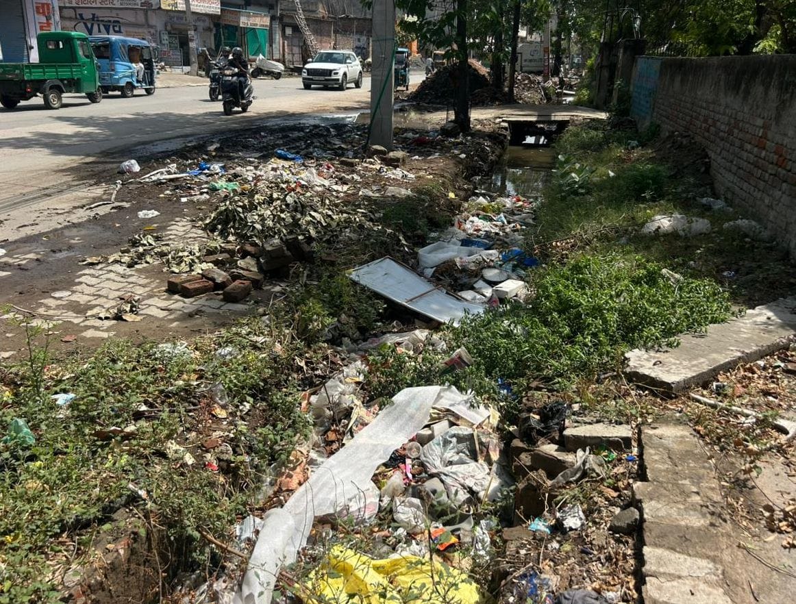 Claims of spending 1 crore annually, yet not even slabs over the drains.