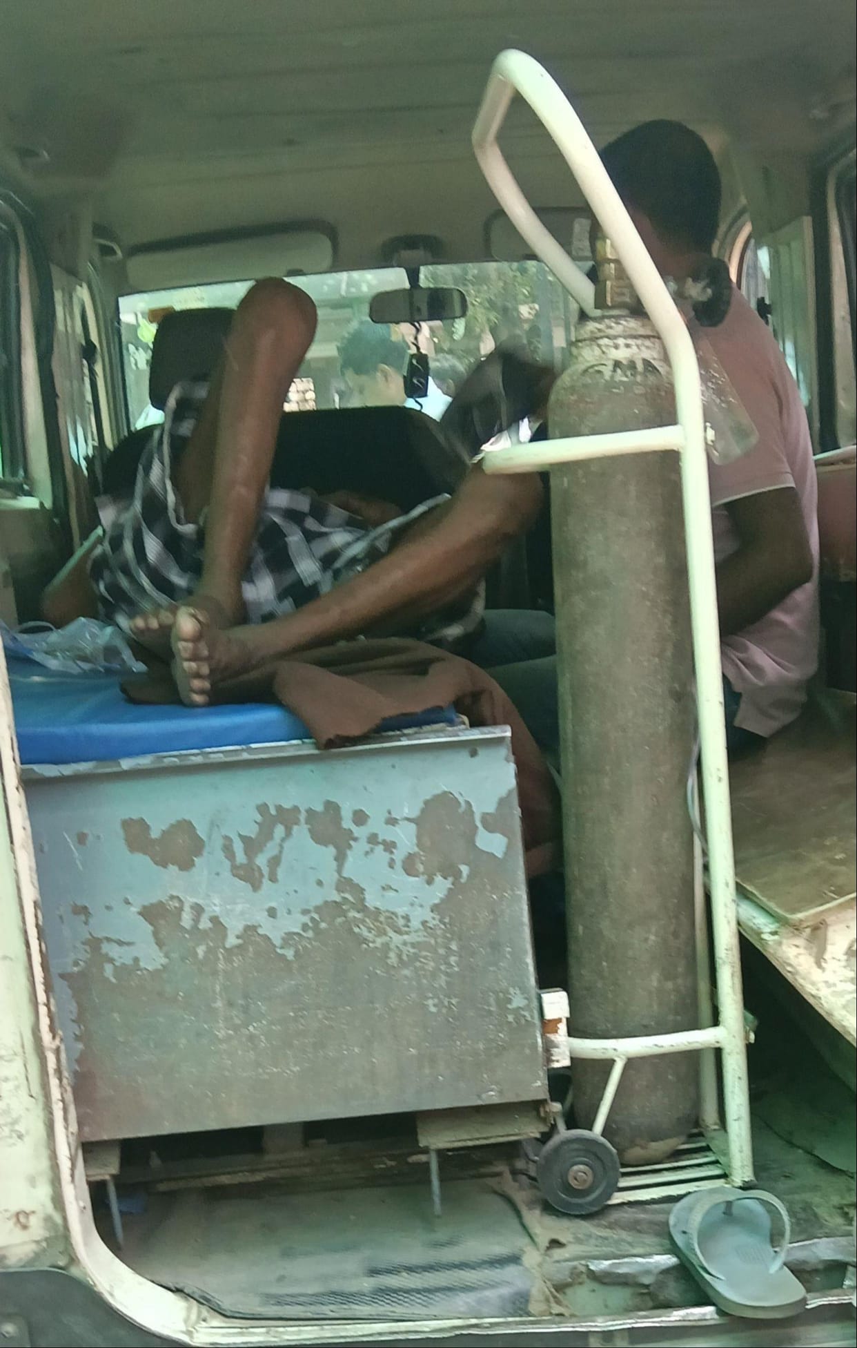 The patient sweltered in the ambulance; a wheelchair became available only after half an hour