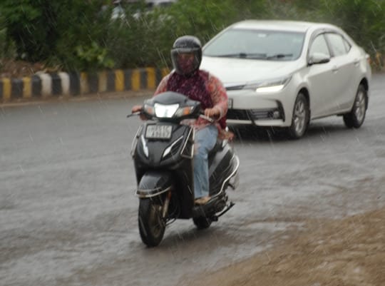 Storm and rain bring some relief from the heat; temperature drops by three degrees.