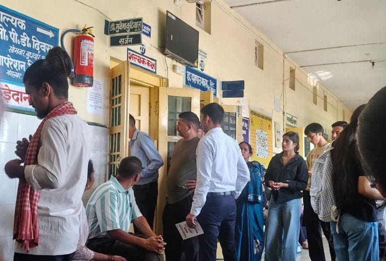 Crowd of patients surges at the district hospital's surgery department.