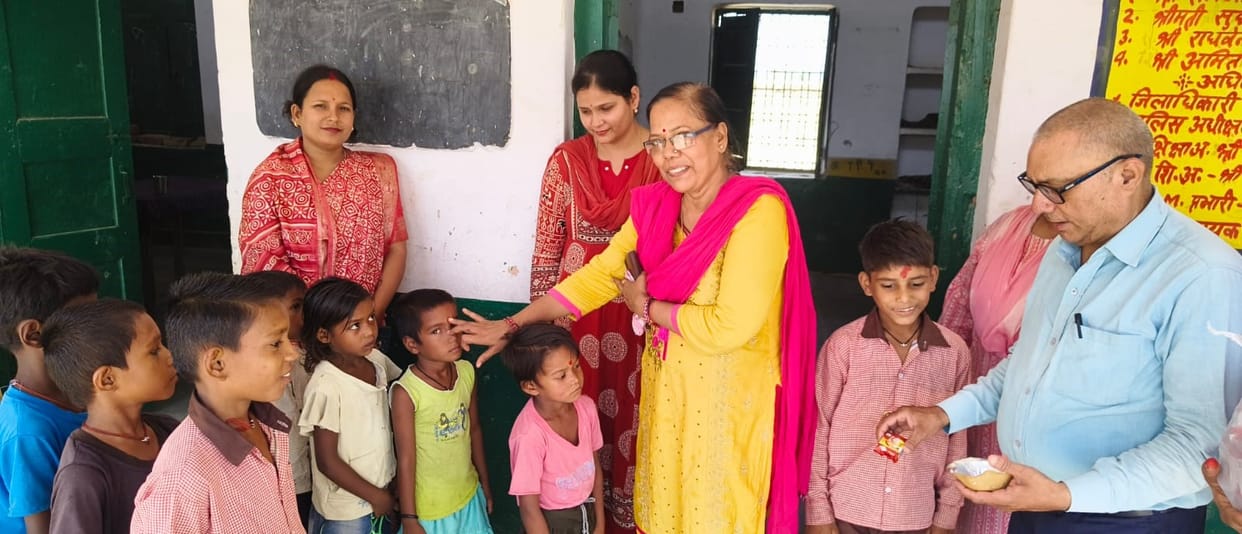 Schools reopened after summer vacation; children welcomed with *roli* and *tika*.