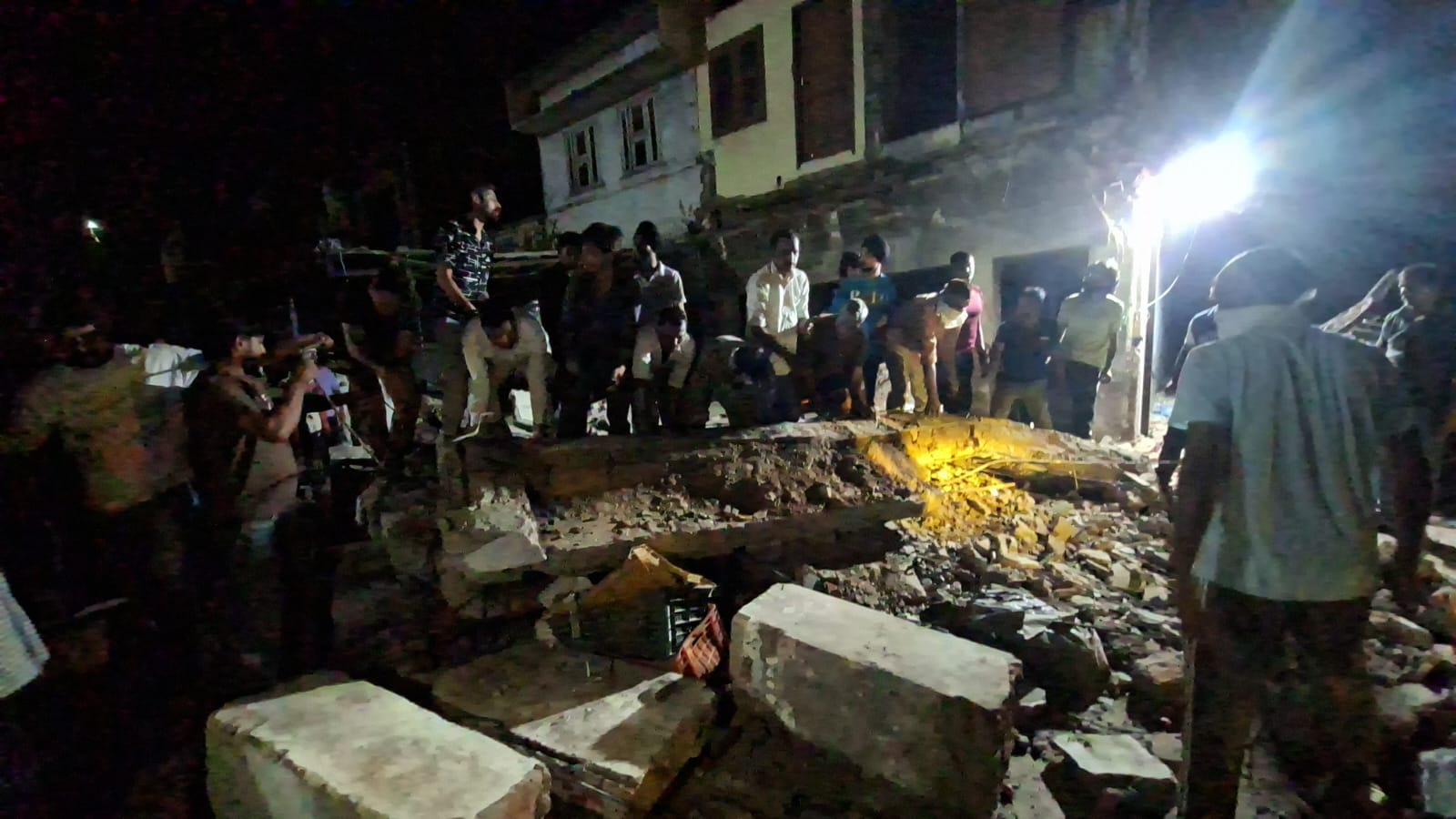 70-year-old dilapidated building collapses; two people injured.
